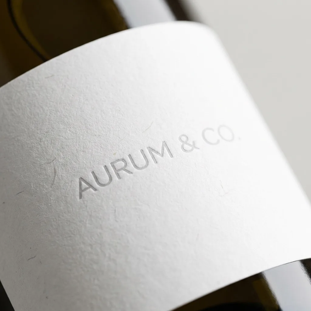 Textured white adhesive label wrapped around a cosmetic-style bottle